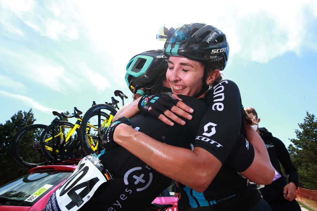 LAGUNAS DE NEILA SPAIN MAY 22 LR Liane Lippert of Germany and final race overall winner Juliette Labous of France and Team DSM celebrate after the 7th Vuelta a Burgos Feminas 2022 Stage 4 a 1251km stage from Covarrubias to Lagunas de Neila 1867m VueltaBurgos BurgosFem UCIWWT on May 22 2022 in Lagunas de Neila Spain Photo by Gonzalo Arroyo MorenoGetty Images