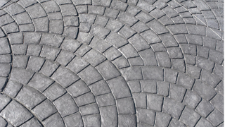 Stamped concrete in grey with European fan design