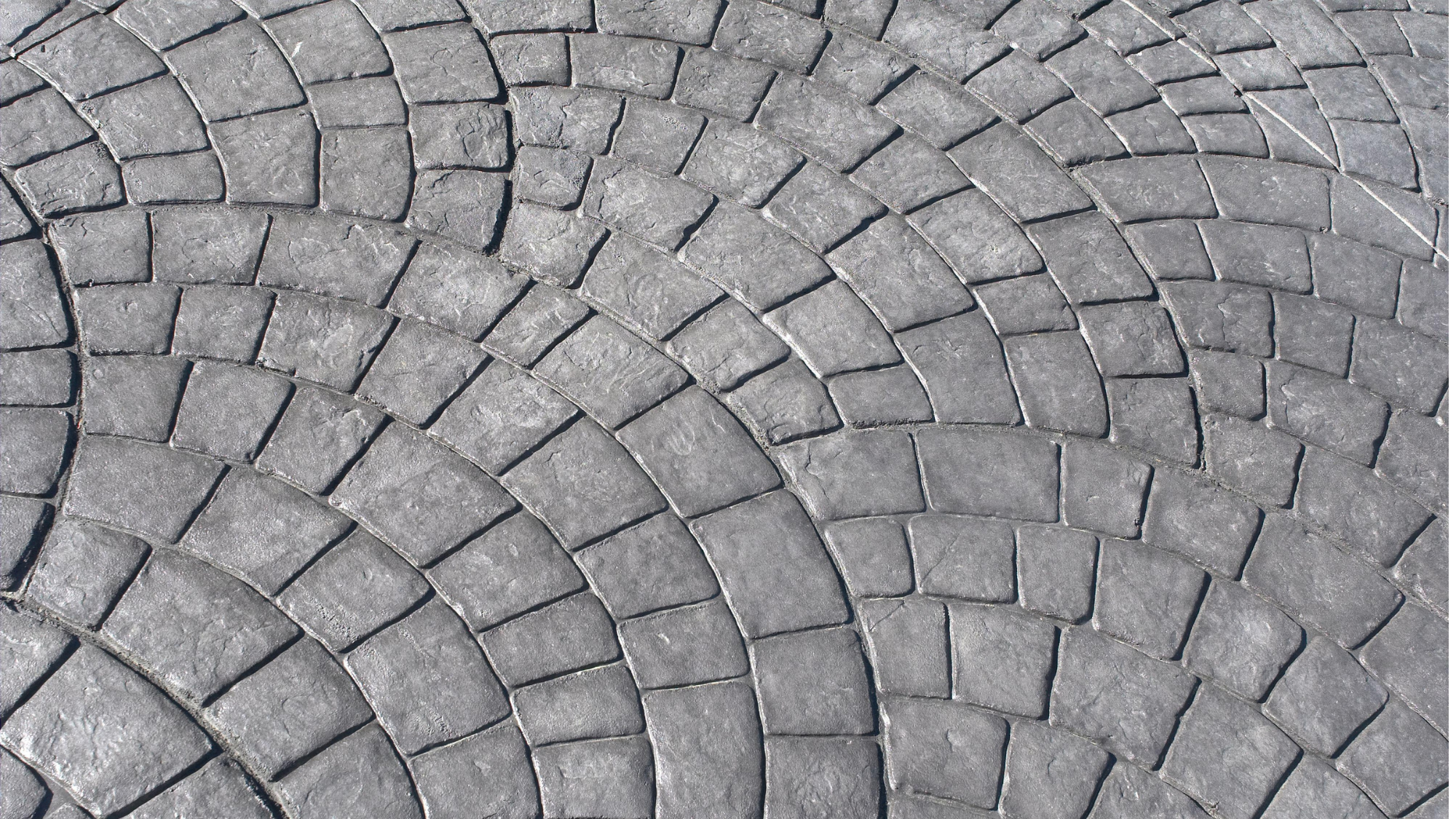 Stamped concrete in grey with European fan design