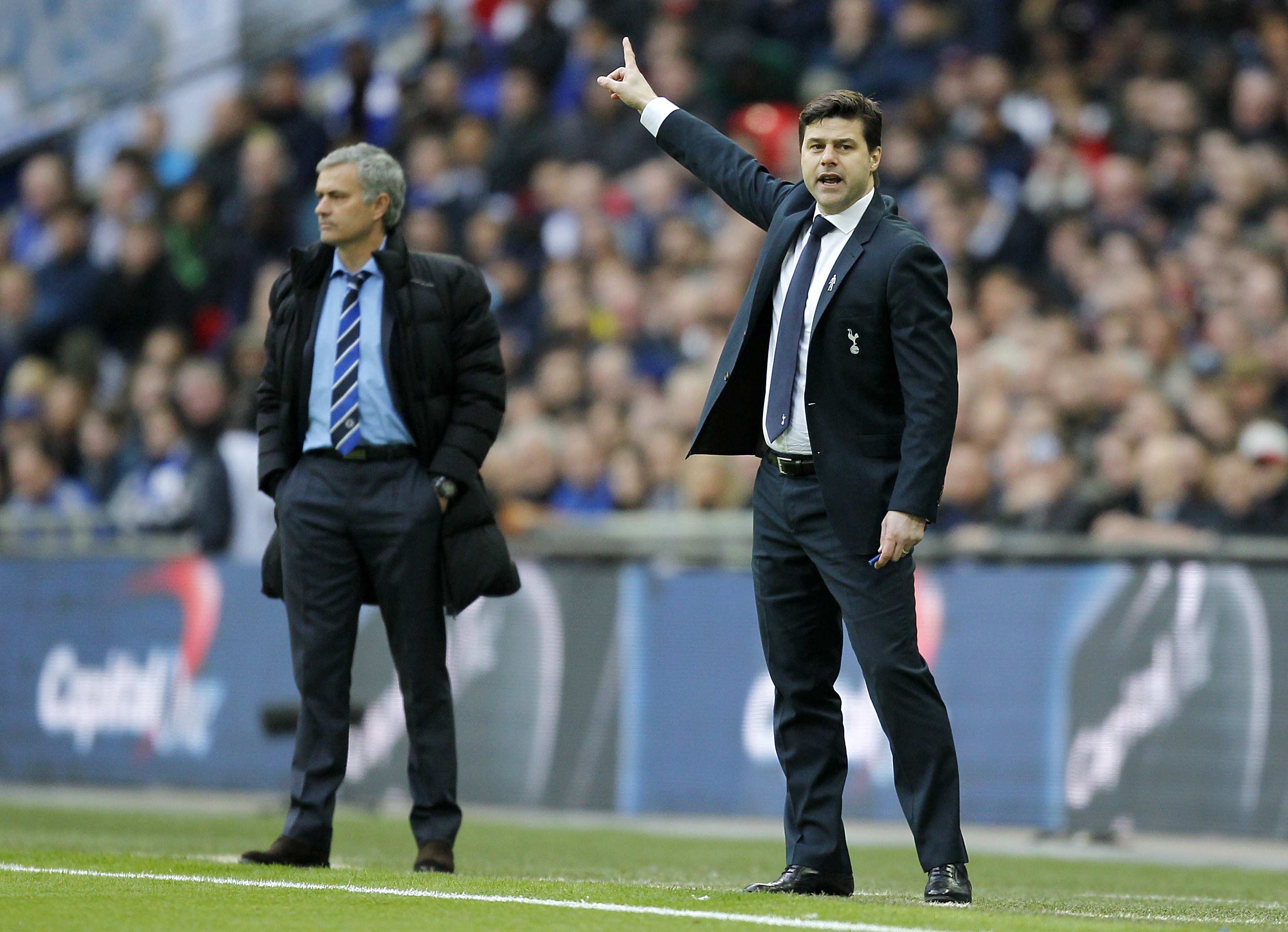 Tottenham manager Mauricio Pochettino gestures during the 2015 League Cup final against Chelsea as Blues boss Jose Mourinho watches on.