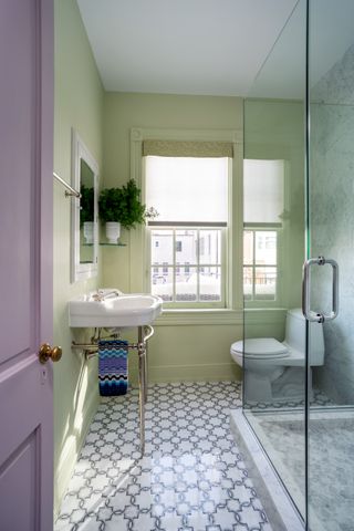 A small bathroom painted green