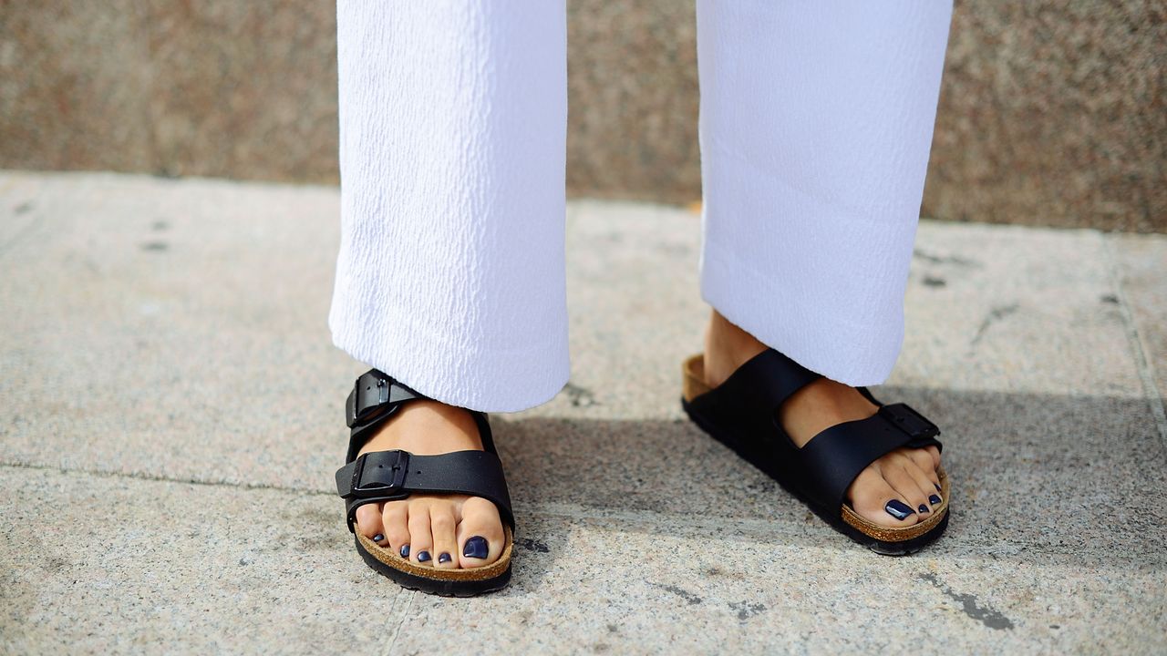 Carola Bernard poses wearing a Come for Breakfast dress and Birkenstock shoes on September 17, 2014 in Milan, Italy. 