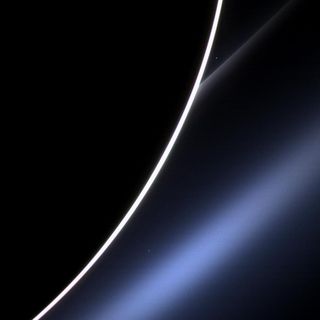 Venus gleams as a bright dot between Saturn's limb and its G ring near the top of this photo, which NASA's Cassini spacecraft took on Jan. 4, 2013.