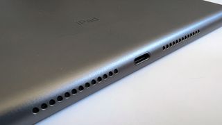 A photograph of the 12.9in 2021 Apple iPad Pro's Lightning port and speakers