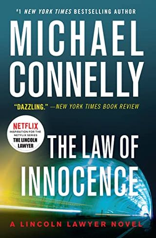 the cover of the lincoln lawyer novel the Law of Innocence featuring a highway tunnel 