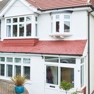 House with white wall and plants