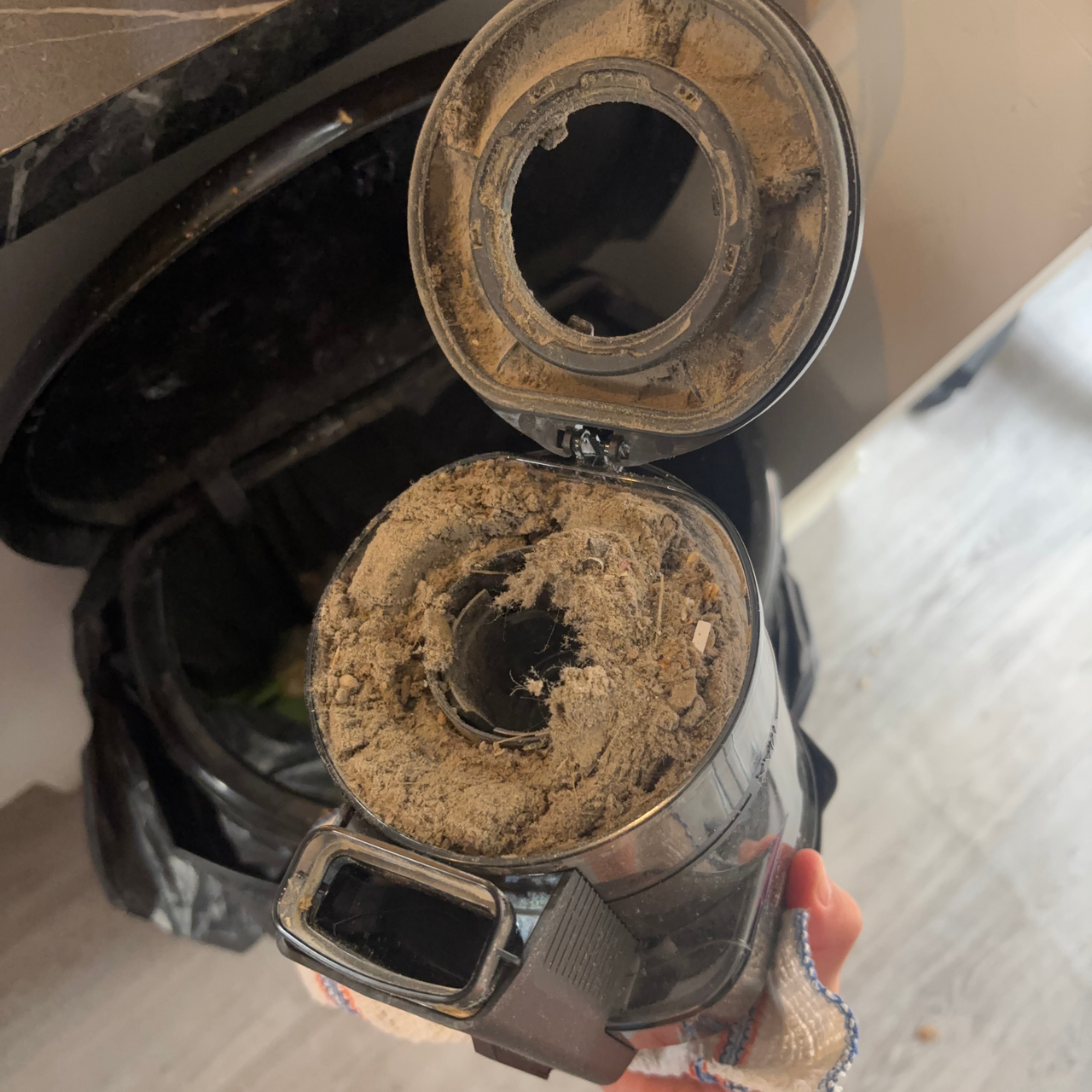 Miele Triflex HX3 Aqua dustbin full of debris