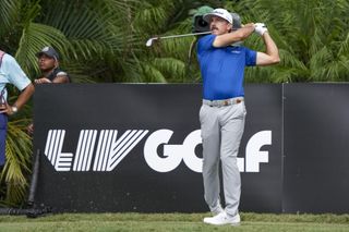 Wade Ormsby hits an iron shot off the tee box