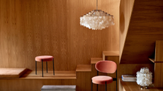 Verner Pantons fun collection capiz shell lights in a wooden clad room