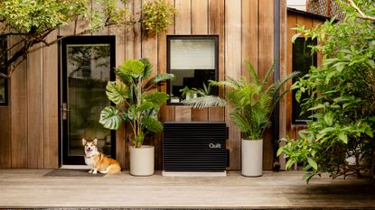 Quilt heat pump fitted to outside of modern house