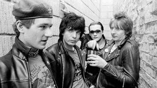 The Damned posing for a photograph in an alleyway in 1977