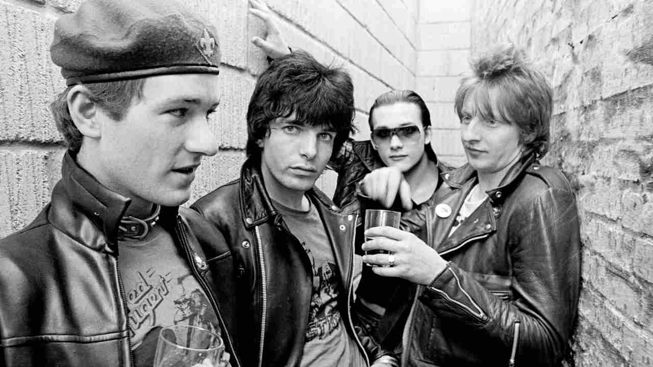 The Damned posing for a photograph in an alleyway in 1977