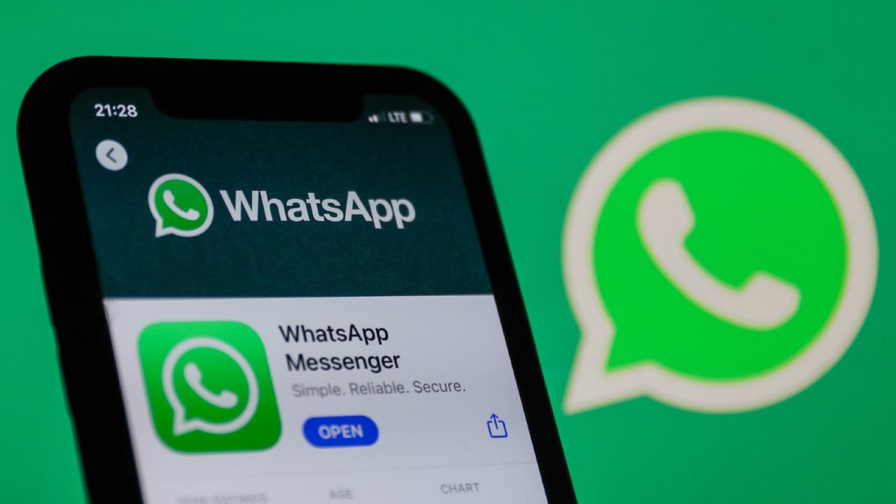 WhatsApp logo on the App Store displayed on a phone screen and WhatsApp logo in the background are seen in this illustration photo taken in Poland on January 14, 2021. Signal and Telegram messenger apps gained popularity due to the new WhatsApp&#039;s privacy policy.