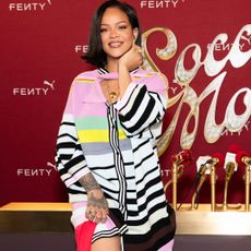 Rihanna wears a striped Christopher John Rogers dress in a press conference for Puma Avanti sneakers