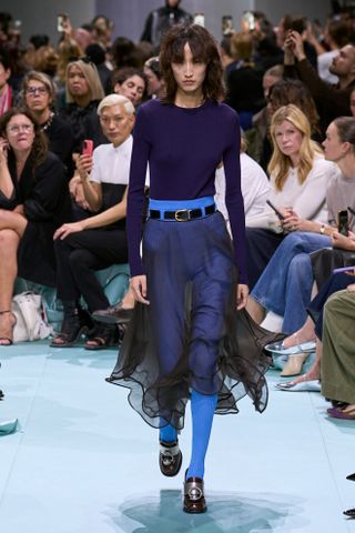 Model wears cobalt blue on the Prada runway.