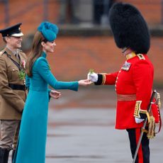  Catherine, Princess of Wales (in her role as Colonel of the Irish Guards) presents traditional sprigs of shamrock to Officers and Guardsmen of the Irish Guards as she attends the 2023 St. Patrick's Day Parade at Mons Barracks on March 17, 2023 in Aldershot, England