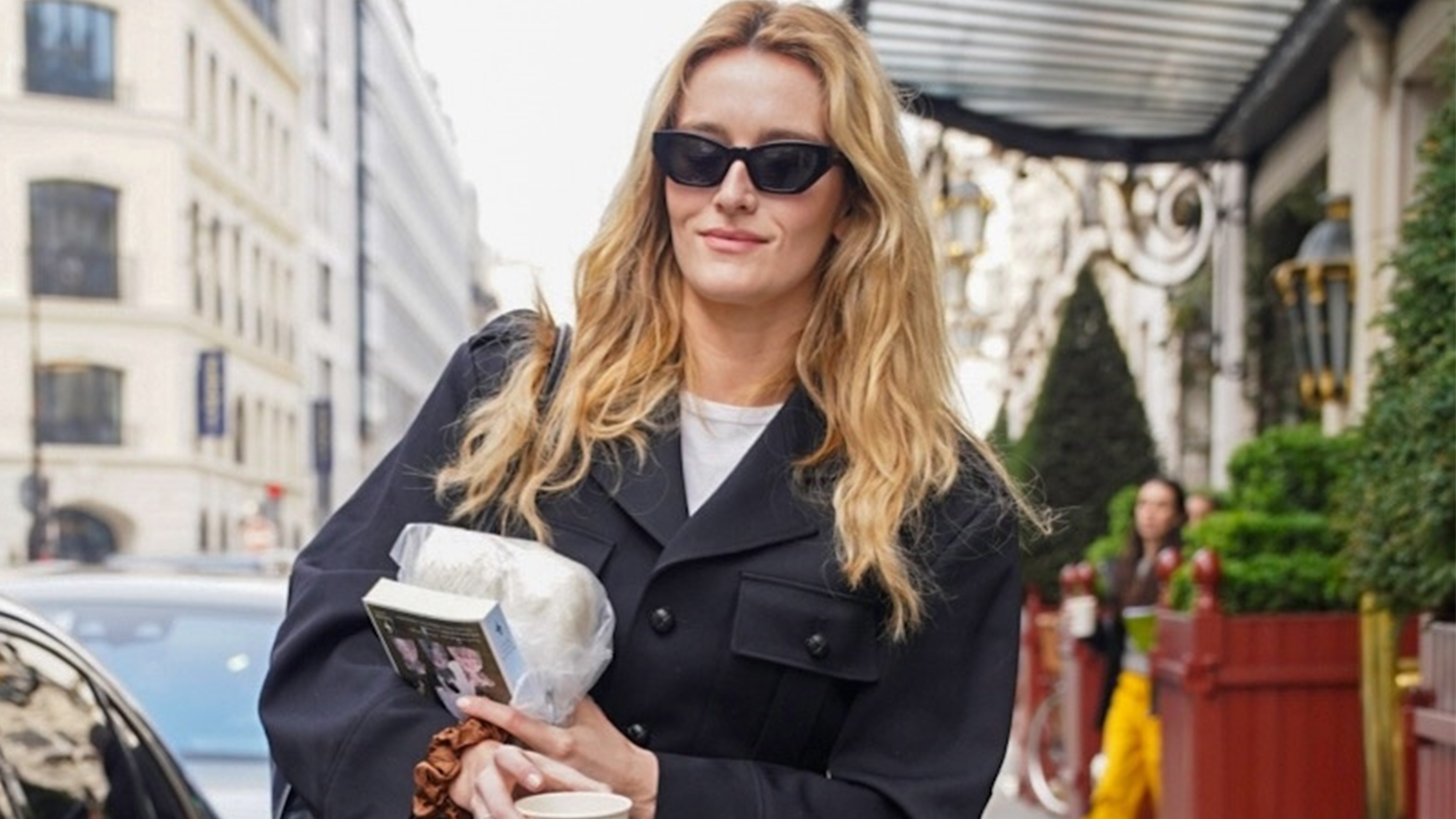 Sarah Pidgeon in Paris during Paris Fashion Week wearing a black Celine jacket, dark-wash cropped jeans, and black loafers. 