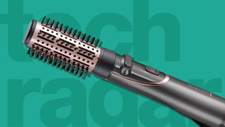 The Remington Curl and Straight Cionfidence Air Styler AS8606 - our best Dyson Airwrap dupe - on a green background