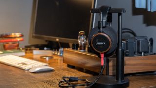 Grado Signature S550 wired headphones in black on a headphones stand