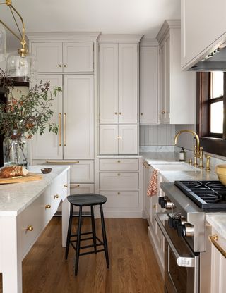 Modern kitchen with cream painted shaker cabinets
