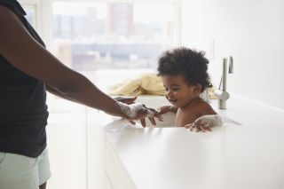 Bathing your baby is how to cool a baby down in hot weather