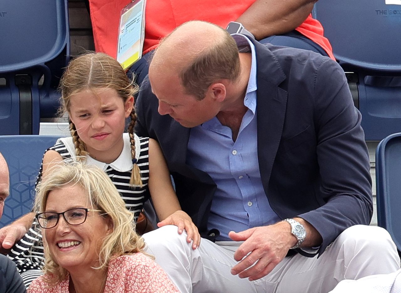 Prince William comforts Princess Charlotte at the Commonwealth games
