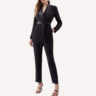 Flat lay image of woman wearing black jumpsuit