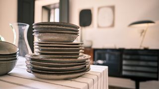dishes stacked on kitchen counter