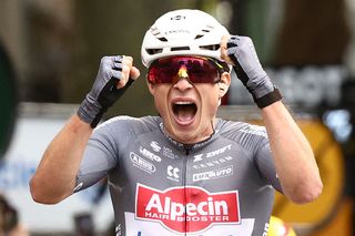 Alpecin - Deceuninck team's Belgian rider Jasper Philipsen cycles to the finish line to win the 1st stage of the 112th edition of the Tour de France cycling race, 184.9 km starting and finishing in Lille Metropole, northern France, on July 5, 2025. (Photo by Anne-Christine POUJOULAT / AFP)