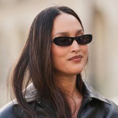 woman with brown hair wearing sunglasses