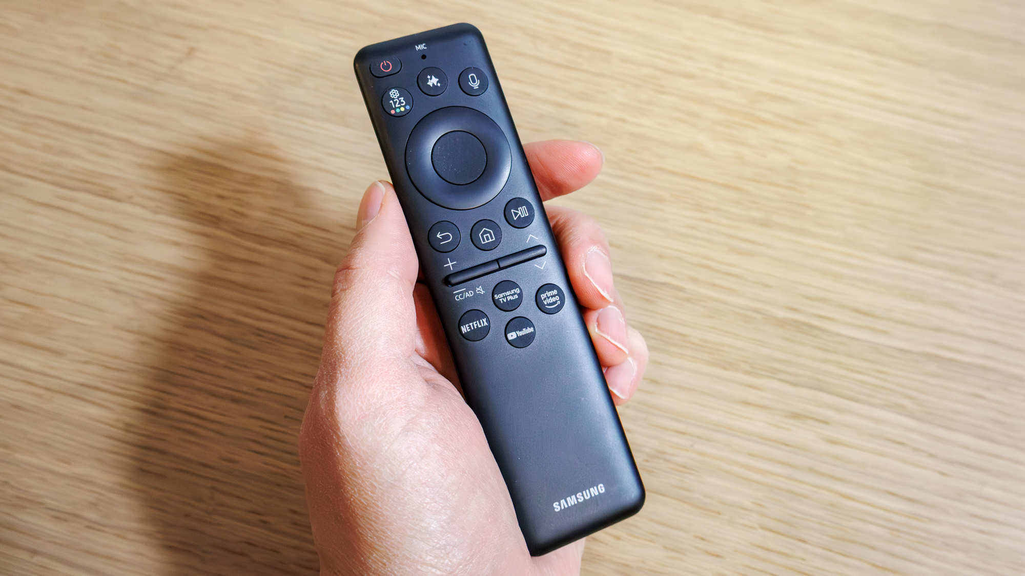 Samsung OLED S85F TV on a table