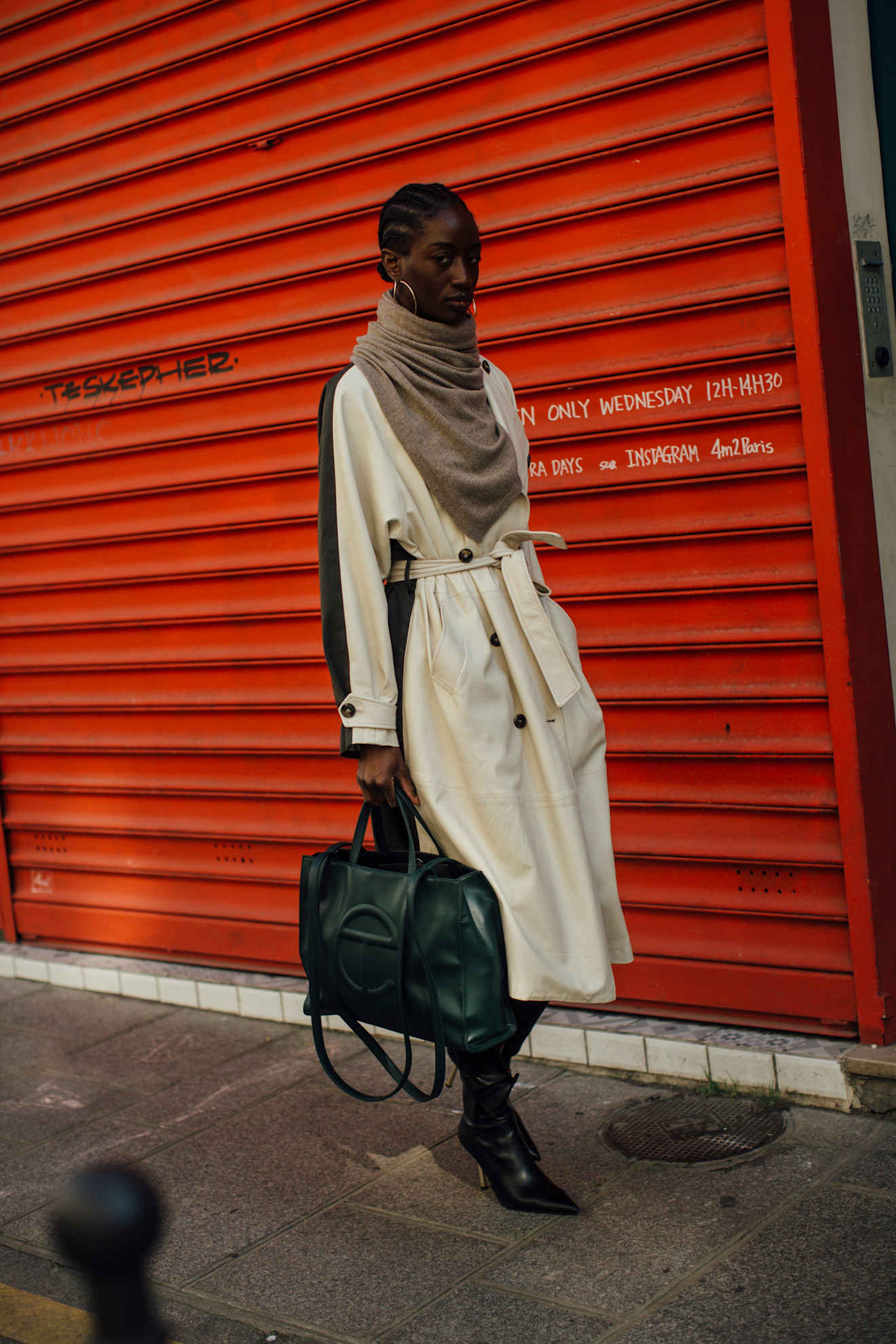Woman wearing a cashmere scarf and trench coat