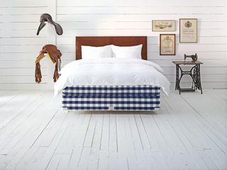 Hästens blue check bed in white bedroom