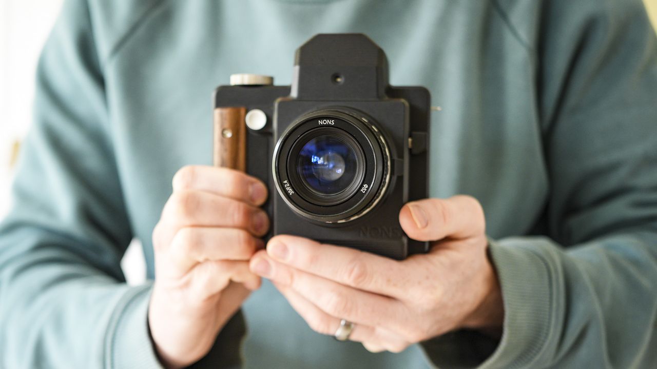 Nons SL660 instant camera in the hand