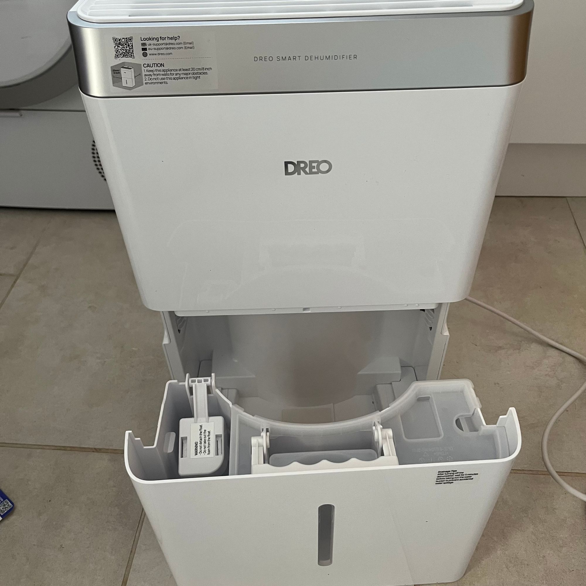 DREO dehumidifier with water bucket removed to show integral handle
