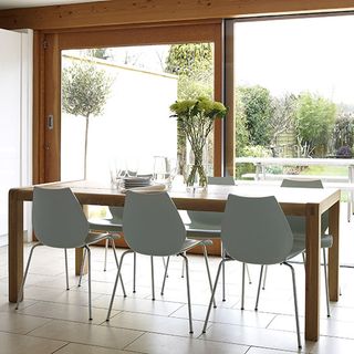 dining room with glass door and table and chair