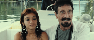 Sam Herrera and John McAfee in Running with the Devil: The Wild World of John McAfee