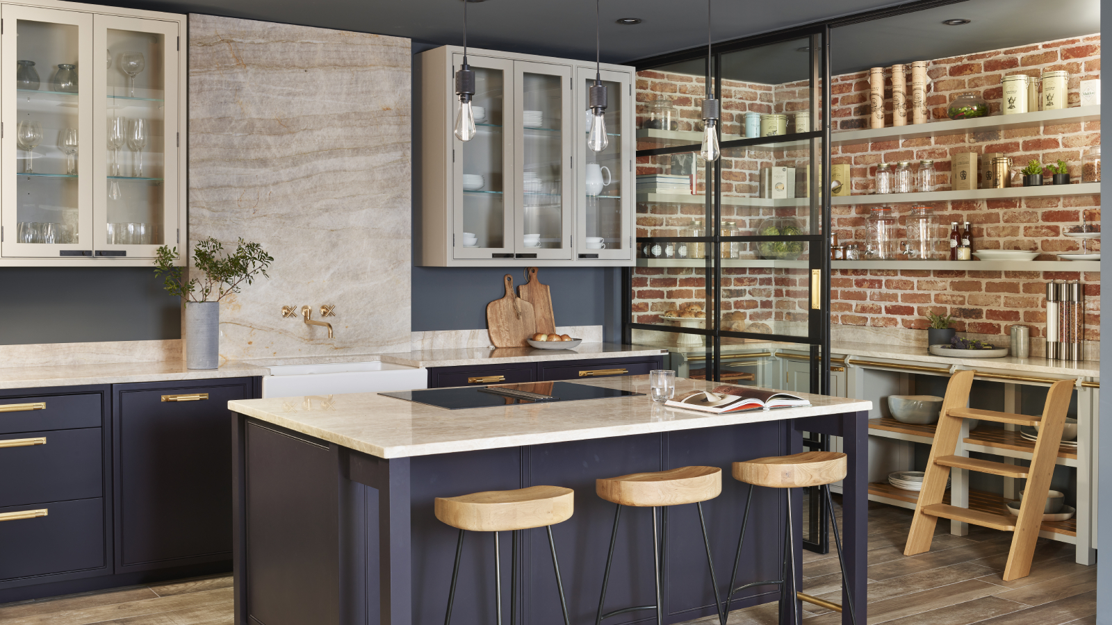 walk in pantry with glass sliding doors dividing it from the rest of the kitchen