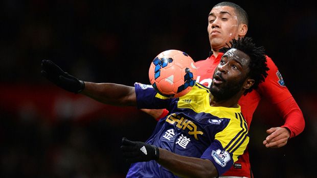 Wilfried Bony and Chris Smalling battle for the ball