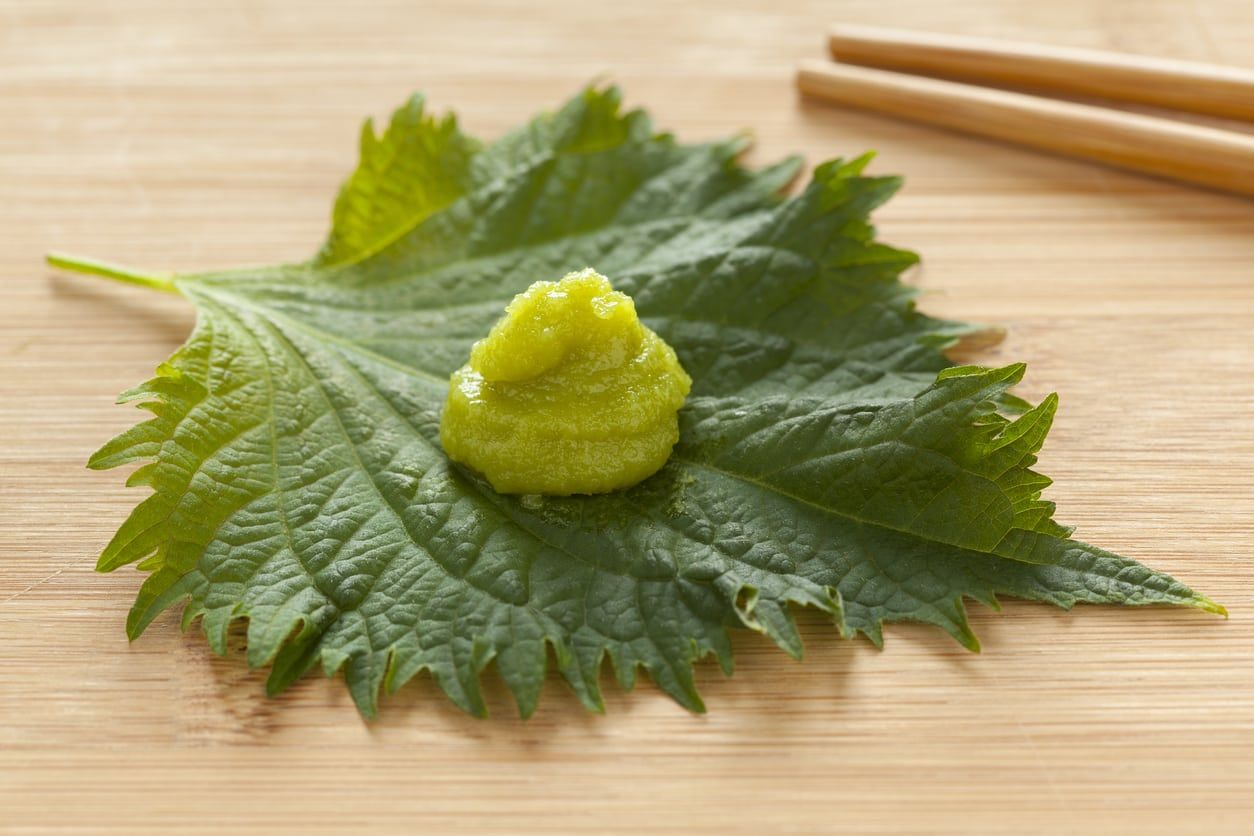 Wasabi On A Leaf Next To Chopsticks