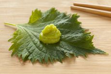 Wasabi On A Leaf Next To Chopsticks