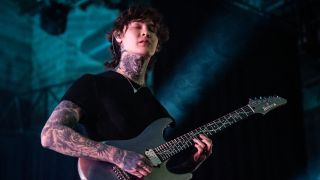 Polyphia guitarist Tim Henson performing live in 2023