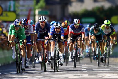 Jasper Philipsen tops Wout van Aert and Mads Pedersen to win stage 15 of the Tour de France.