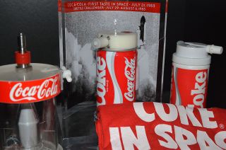 Coke in space: Coca-Cola in space memorabilia, including one of the original 1985 space Coke cans (center).