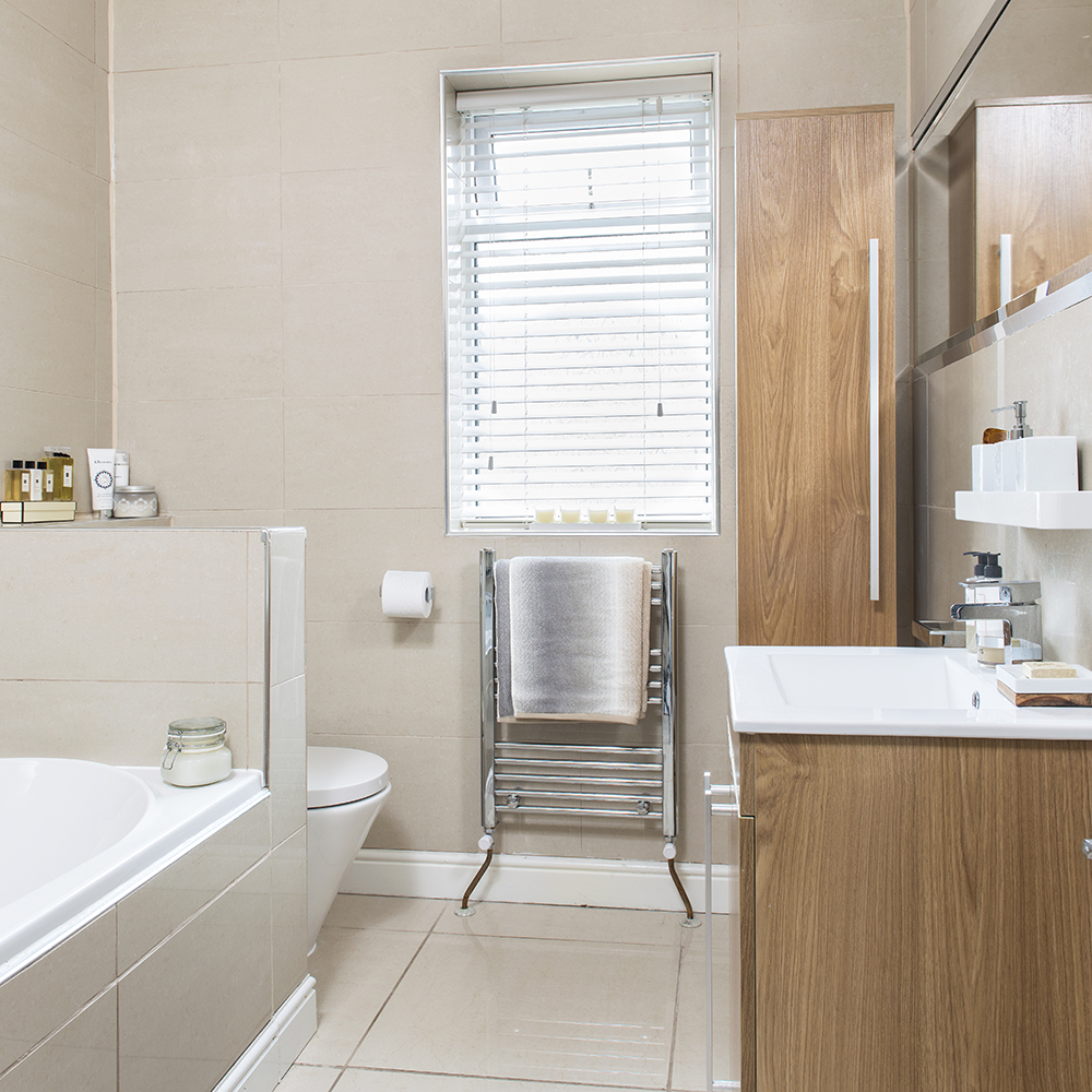 bathroom with wooden cabinets