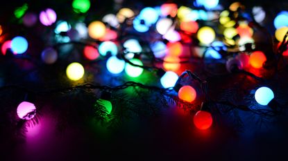multicolored christmas lights strung out on the floor