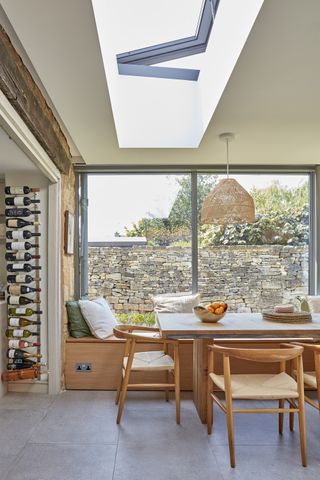 dining room with bench seating and open roof light