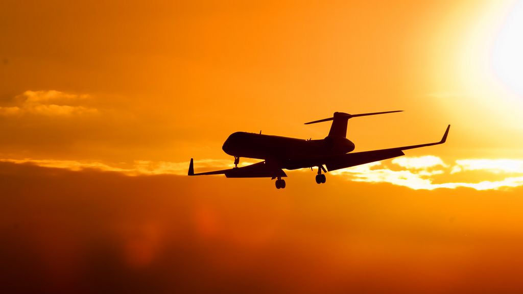 Airplane with sunset in the background