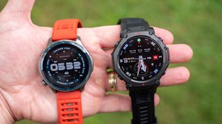 Holding an Amazfit Balance 2 and Amazfit T-Rex 3 Pro