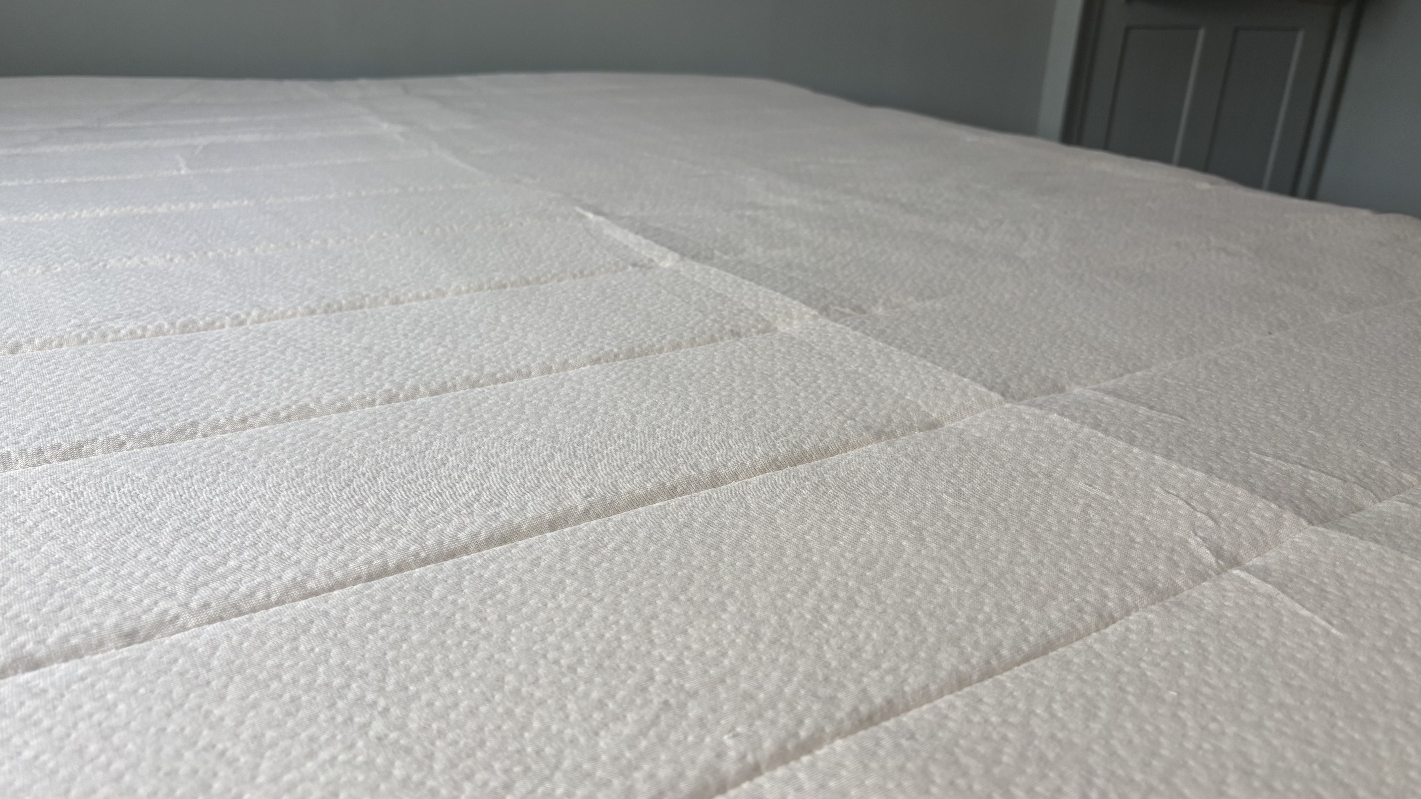 A close-up look of the organic cotton surface of the Birch Plush Organic Mattress Topper